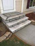 view of the steps with concrete countertop