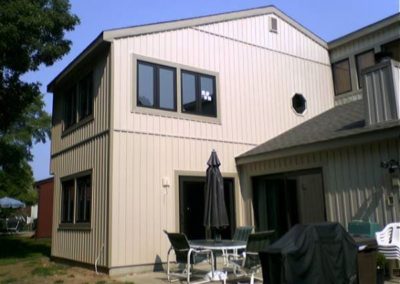 view of a house with a small seating area