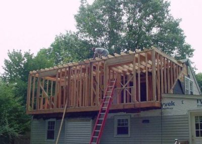 A contruction worker on the roof of an under construction structure