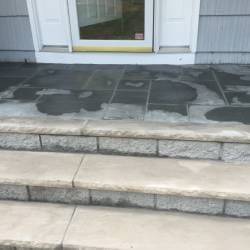 view of the steps with block work and concrete countertop