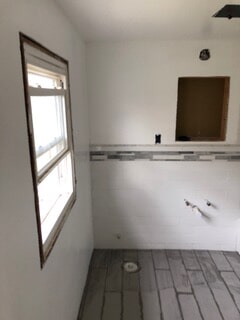 corner view of floor after tile work and window