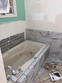 corner view of the bathtub during renovation