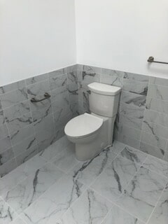 corner view of the toilet after renovation