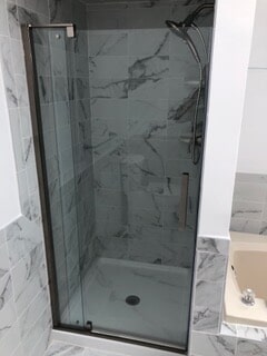 front view of the glass shower with sliding door
