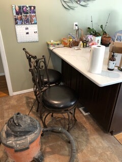 view of the table and chair along with machine for renovation work