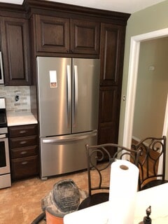 front view of fridge and chairs
