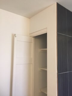 corner view of storage area in the bathroom